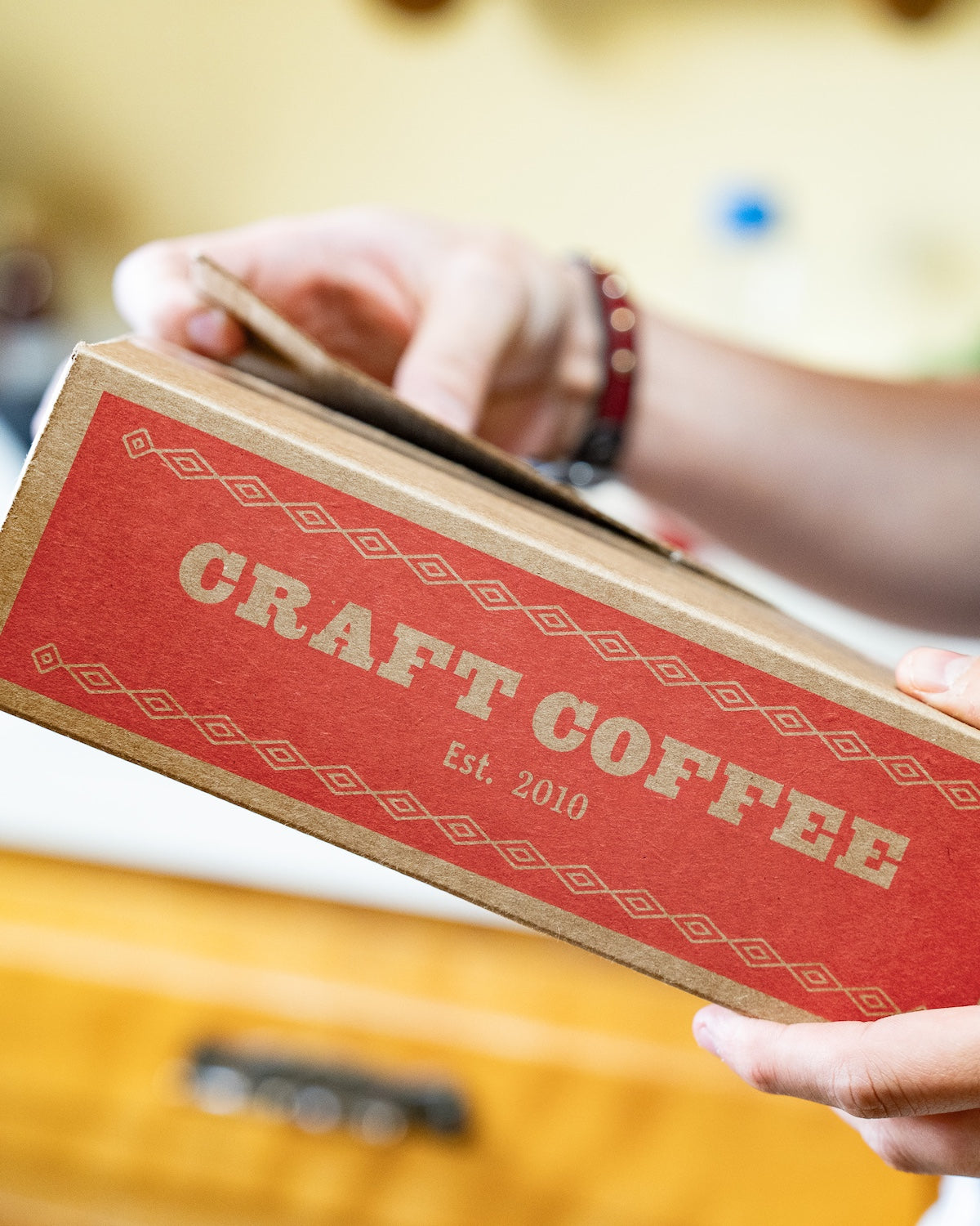 Opening a red Craft Coffee box